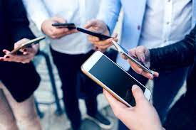 people on cell phones at work